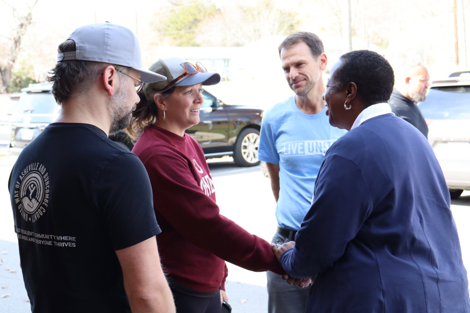 Angela Williams meets Owen Middle School Assistant Principal Megan Davis, alongside UWABC's Josh Wells and CEO Dan Leroy